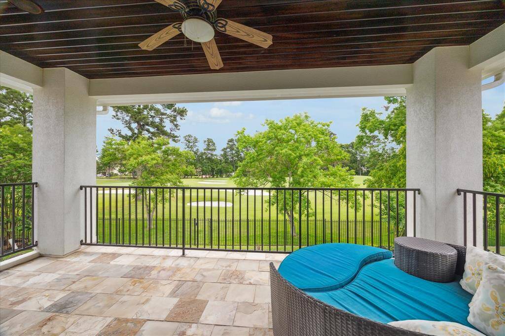 Accessed from the game room, this sweeping balcony overlooks the pool and provides a breathtaking view of the manicured grounds of the Gary Player course.