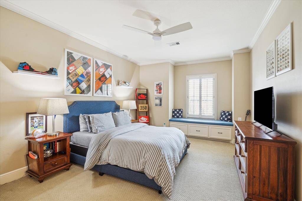 The secondary bedrooms upstairs are spacious and exude the same character found on the first floor. A window bench provides a charming reading nook.  This bedroom enjoys direct access to its full bath.