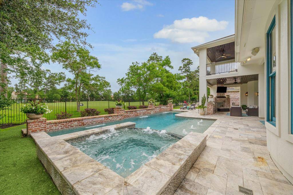 The tastefully designed pool and spa compliment the home and its repeated architecture and style. The pool and backyard are beautifully framed by the golf course beyond.