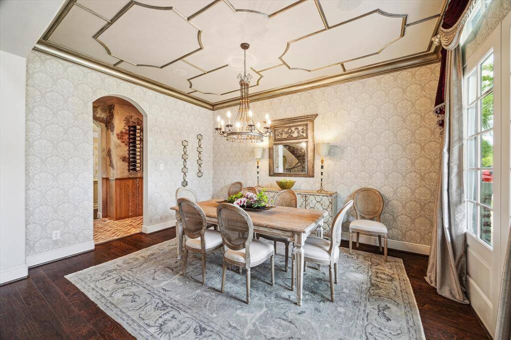 The formal dining room boasts handsome wood flooring and is bejeweled with custom lighting which casts a soft warm glow on dinner guests.  The formal dining room conveniently flows directly into the wine room/butler's pantry for effortless serving and entertaining.