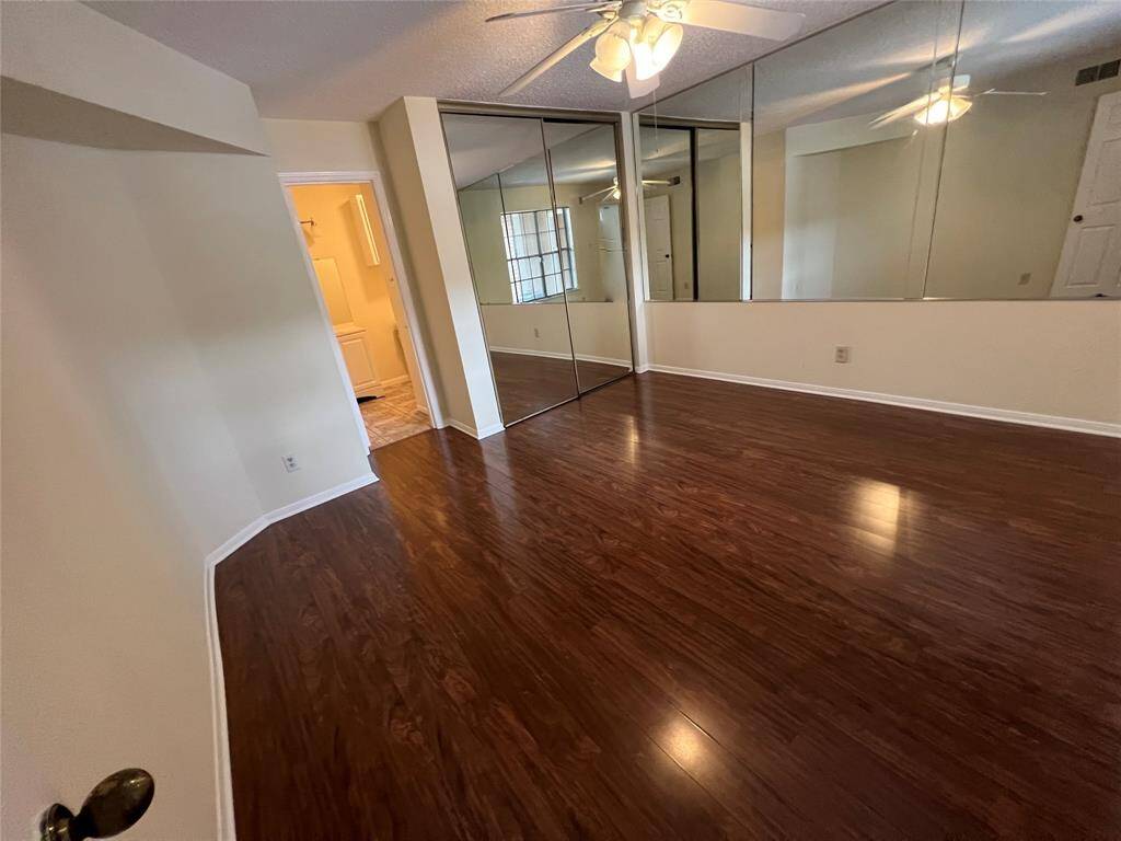 Bedroom 2, located to the right of entry, features walk-in closet and en suite bath.