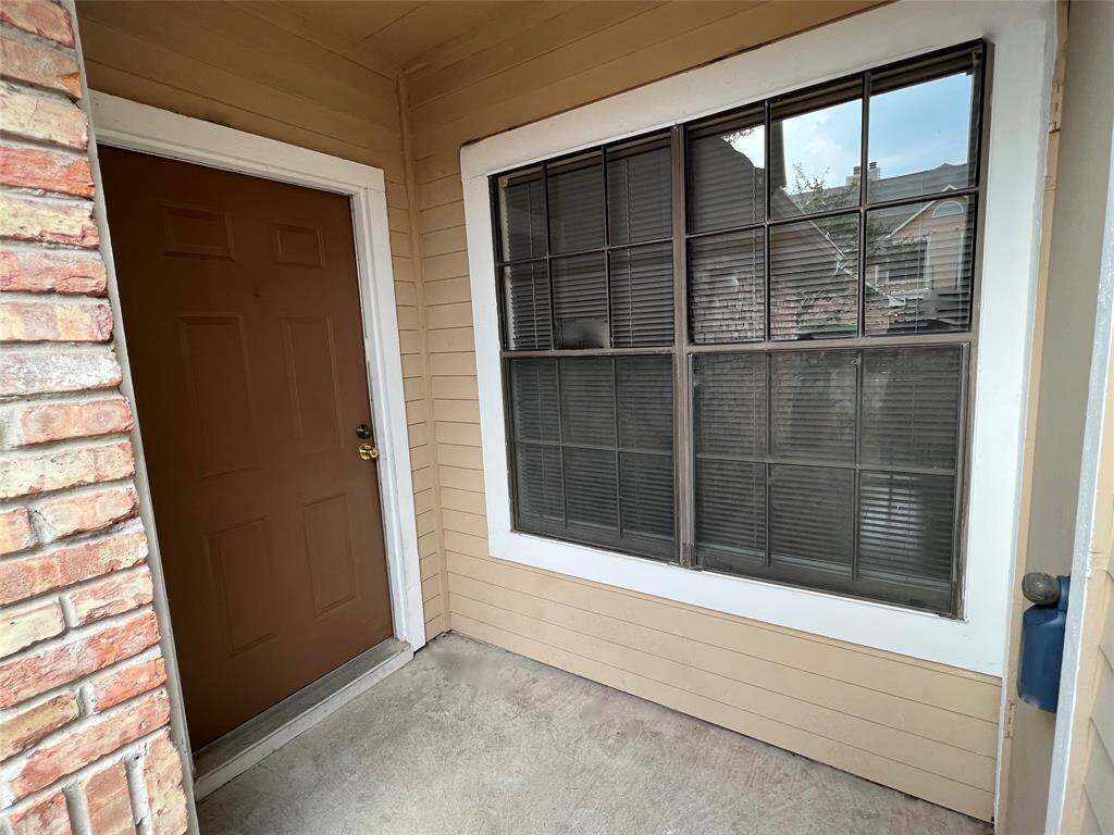 Small storage unit across from front door.