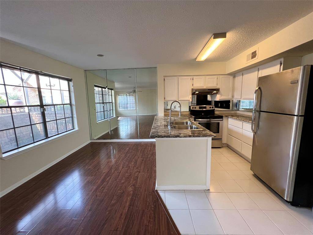Plenty of storage space with drawers, instead of cabinetry. Refrigerator included!