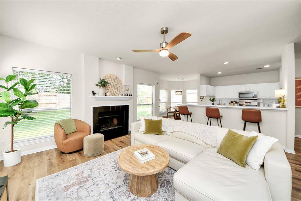 The spacious family room, conveniently located right next to the kitchen, features an open-concept floor plan that enhances the home’s flow. With plenty of room for your favorite furniture, it’s the perfect spot to relax or entertain.