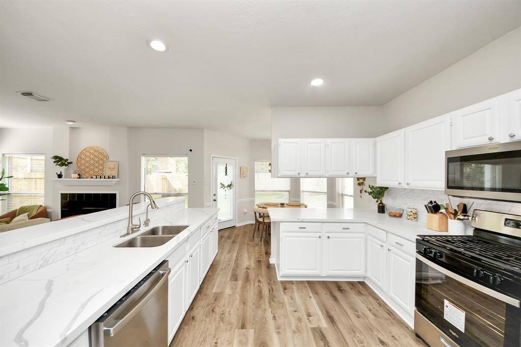 Welcome to the heart of the home—a chef’s dream kitchen equipped with stainless steel appliances, sleek quartz countertops, and stunning cabinetry. It’s designed to inspire your best meals and gatherings.