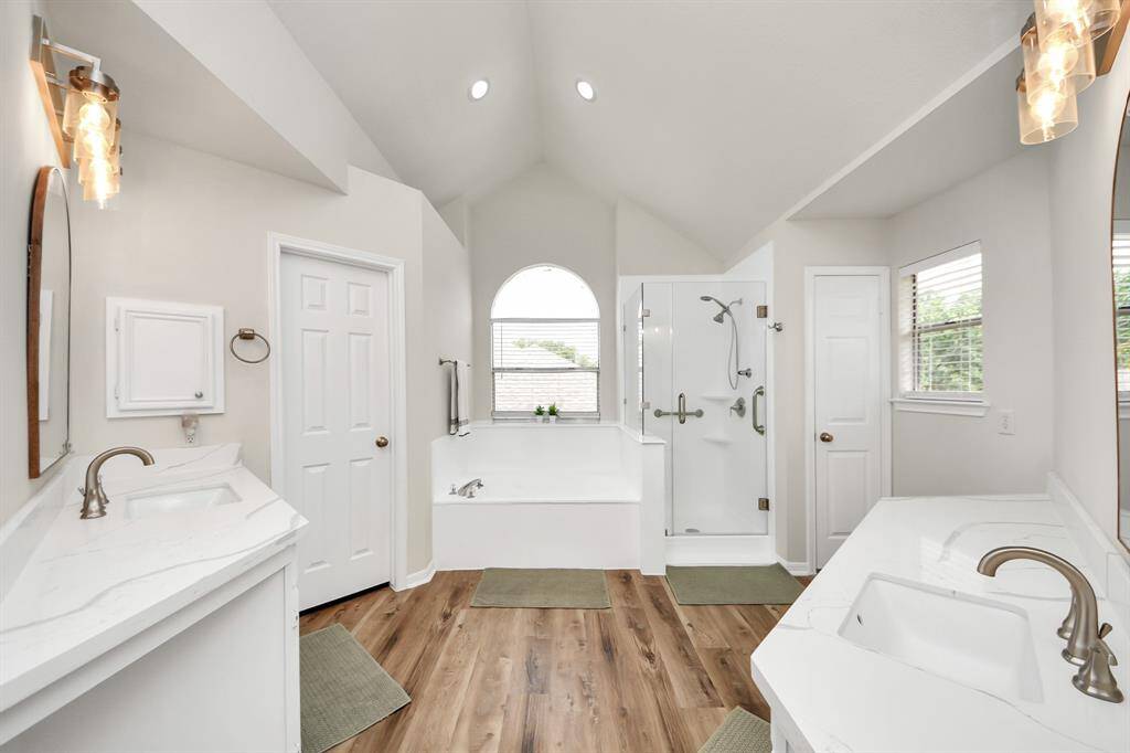 Wow! Step into the bright, clean primary ensuite, where a spacious dual-sink vanity offers plenty of room for busy mornings. With generous counter space, abundant storage, and two separate closets, this bathroom is designed to meet your daily needs with ease and style.