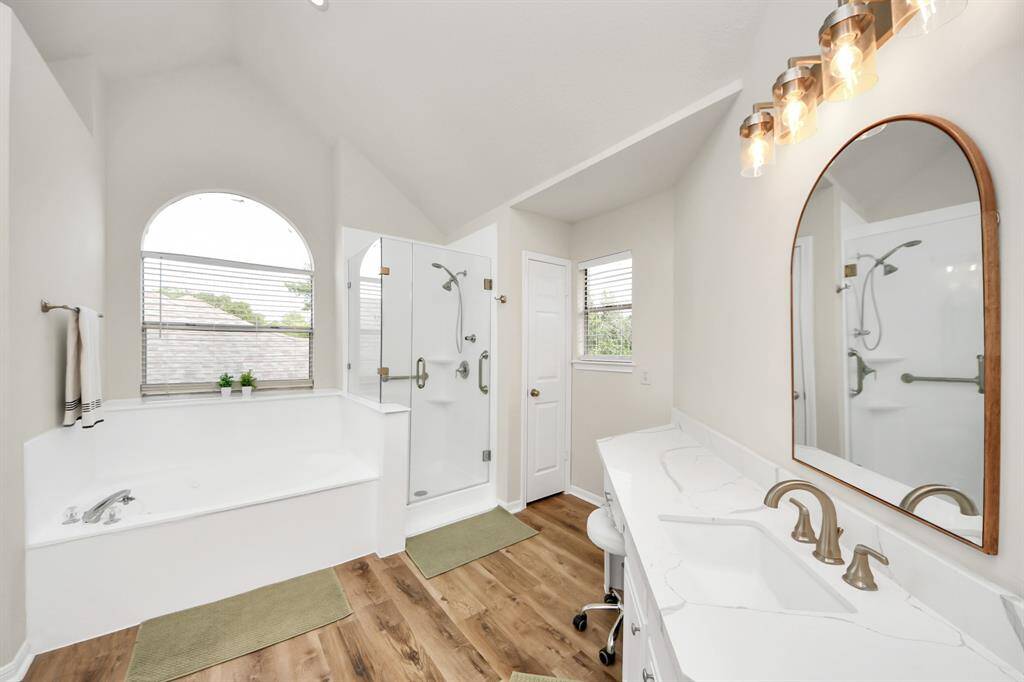Additional look at the spacious primary bathroom—featuring tons of room to move and unwind in style!
