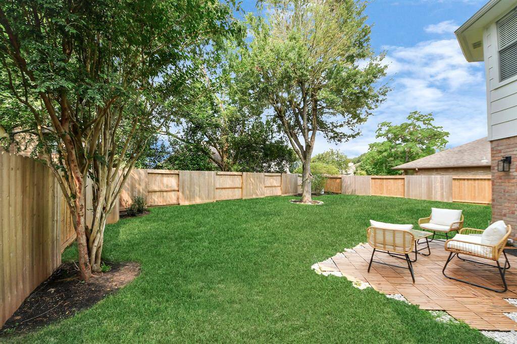 Step out onto the inviting back patio—easily accessed through the back doors—perfect for entertaining. With a comfortable layout and seamless connection to the backyard, it’s an ideal spot for outdoor dining, relaxing, and making lasting memories with friends and family.