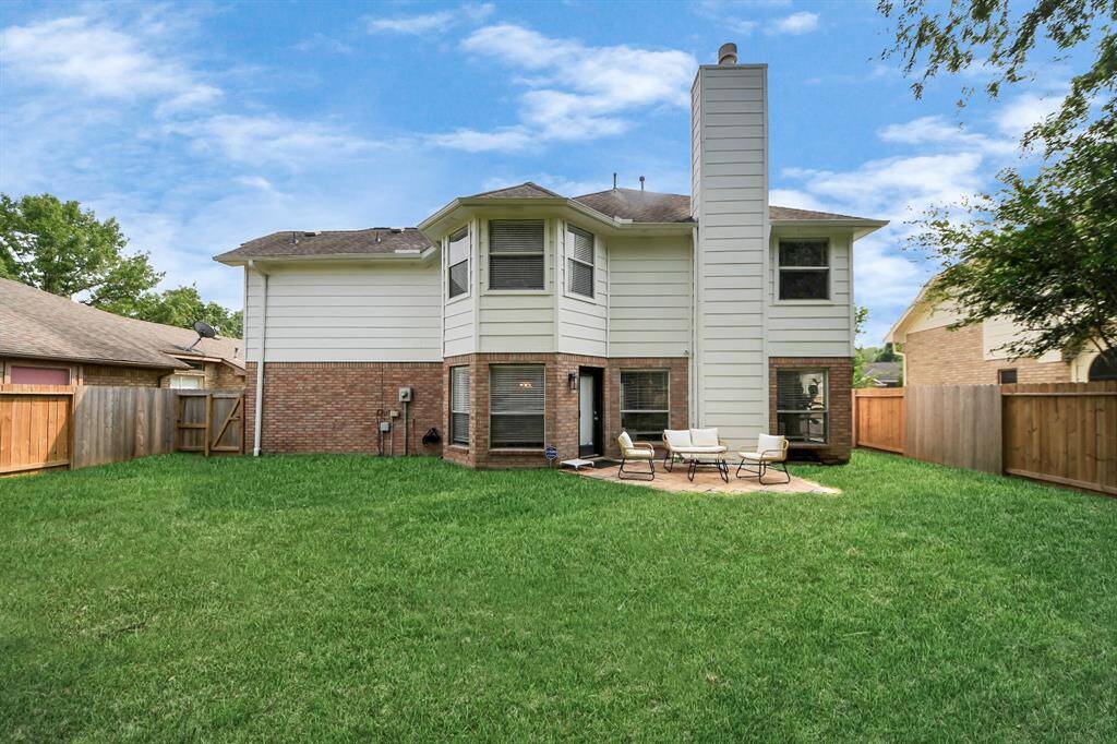 Check out the spacious backyard — complete with a fence, gated access, and plenty of room to enjoy, play, or entertain. A perfect outdoor retreat!