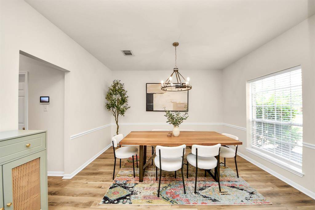 The formal dining room offers seamless access to the kitchen, making entertaining feel effortless.