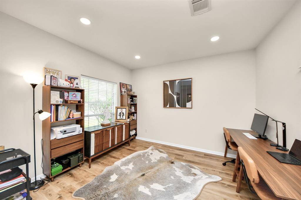 The flex space at the front of the house features a large window that fills the room with natural light, offering endless possibilities.