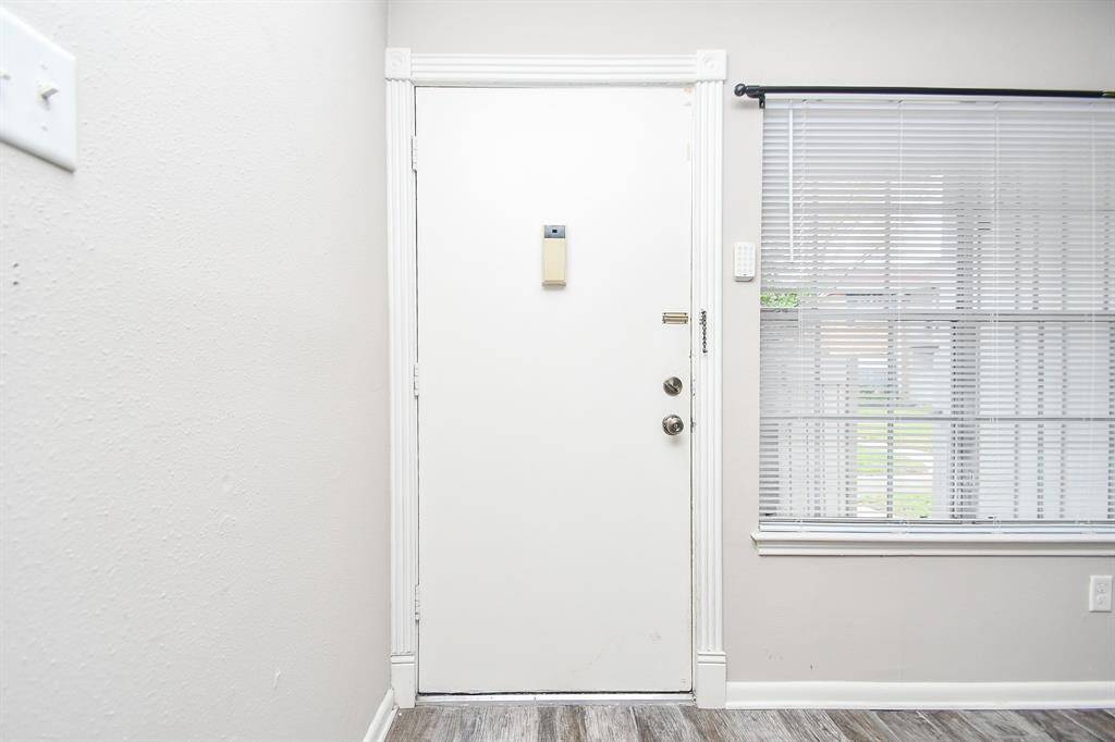 Wood-look tile flooring upon entering the unit!