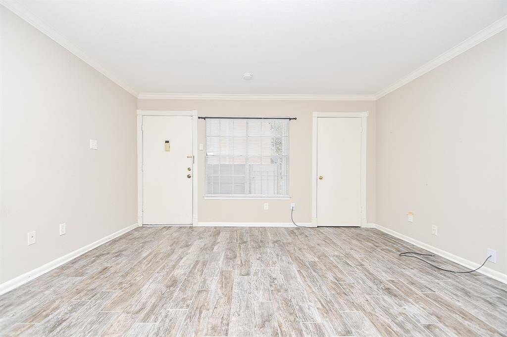 Crown molding adorns the open living room!