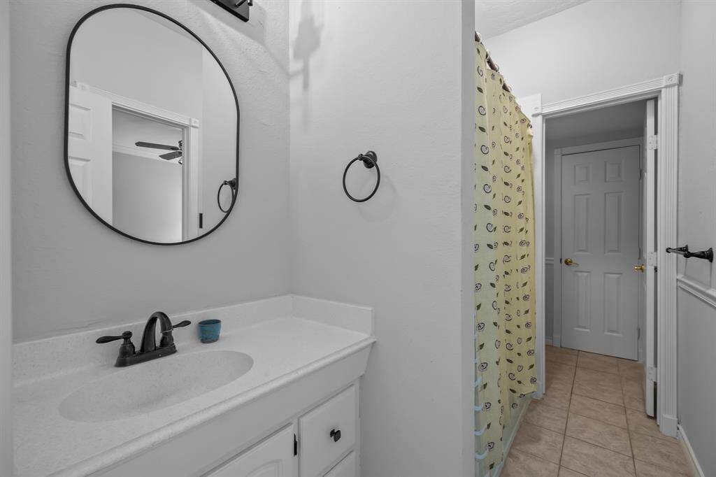 The Jack-and-Jill bathroom has also been beautifully updated and features a tub-shower combo for added convenience and style.