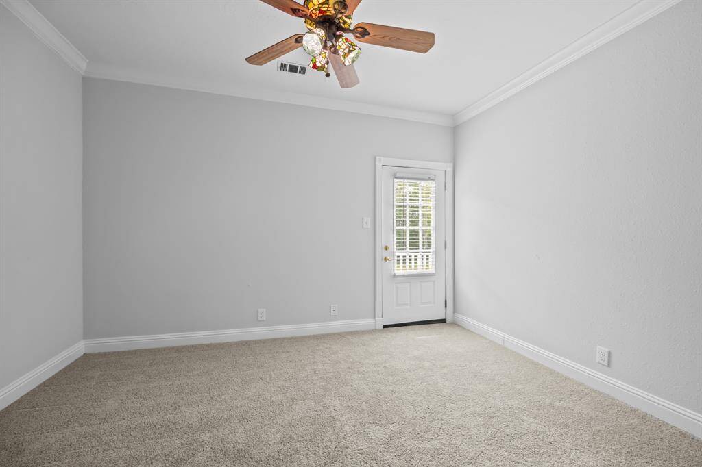 Bedroom 3 features fresh paint, new carpet, and its own private balcony—perfect for enjoying a quiet moment outdoors.