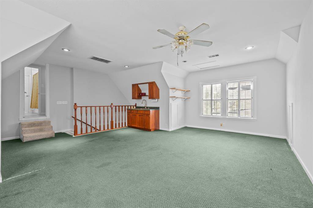 Access to the garage apartment/game room is conveniently located through the Jack-and-Jill bathroom—an ideal bonus space for growing kids or teens needing a little extra room.