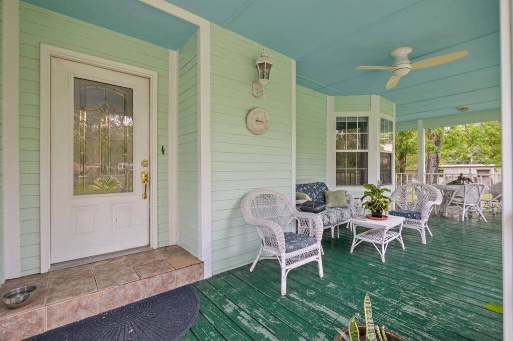Unwind on the covered porch—perfect for reading, relaxing, and savoring life at a slower, more peaceful pace.