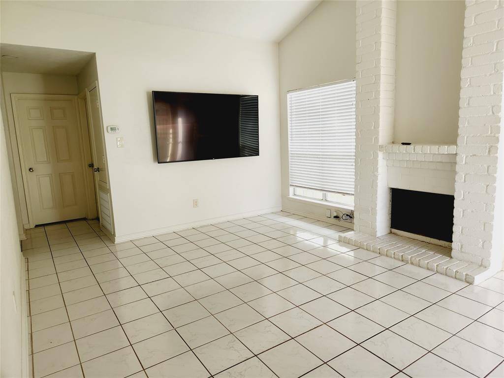 living area with mounted television