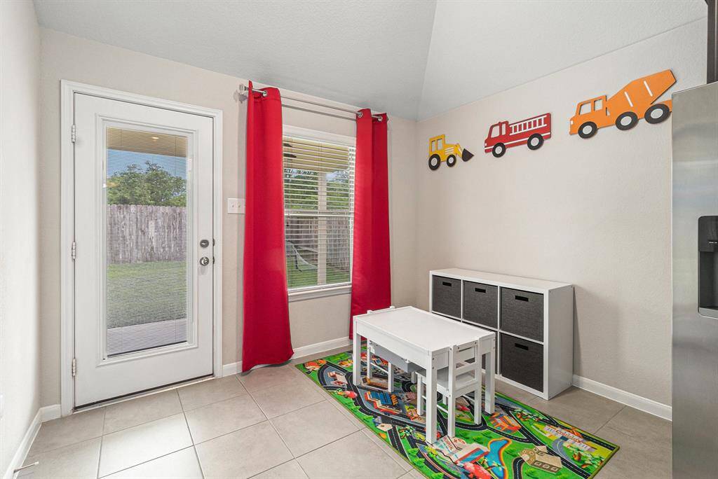 Breakfast room is currently used as a play space with views to your backyard.