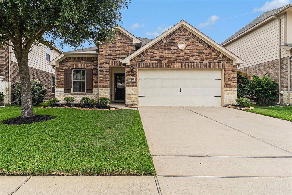 Charming single-story brick home with a two-car garage, well-manicured lawn, and a welcoming front porch. Ideal for buyers seeking a cozy, low-maintenance property.