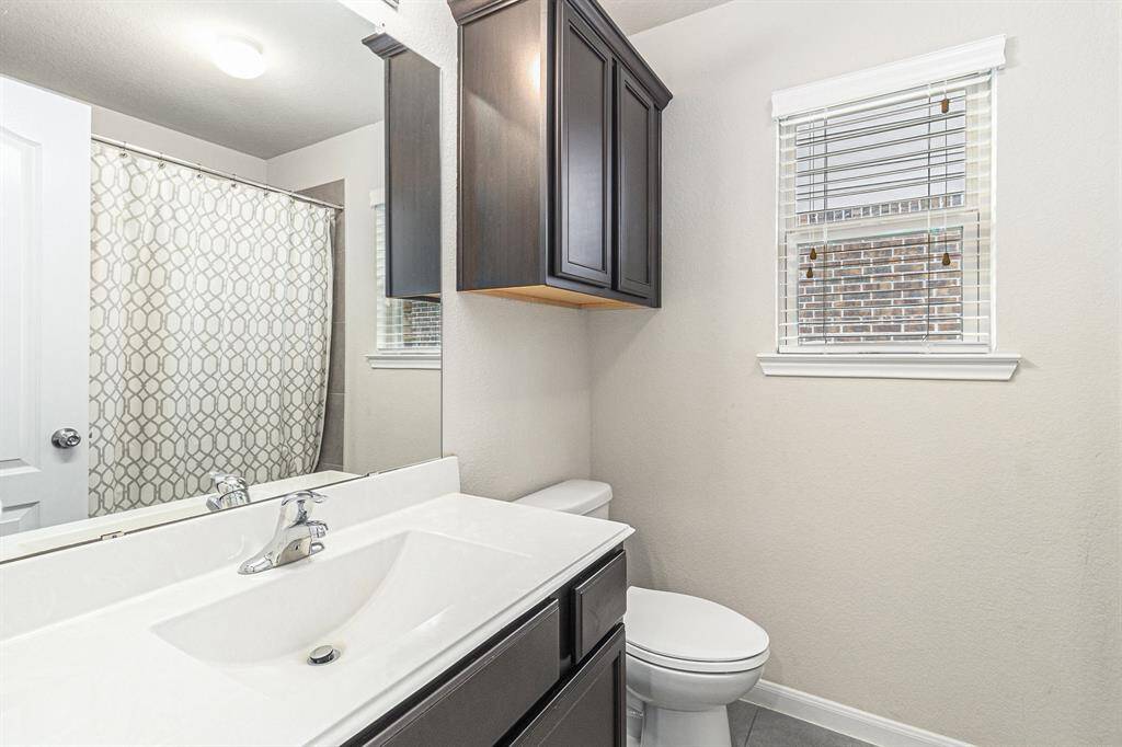 Full bathroom with additional storage
