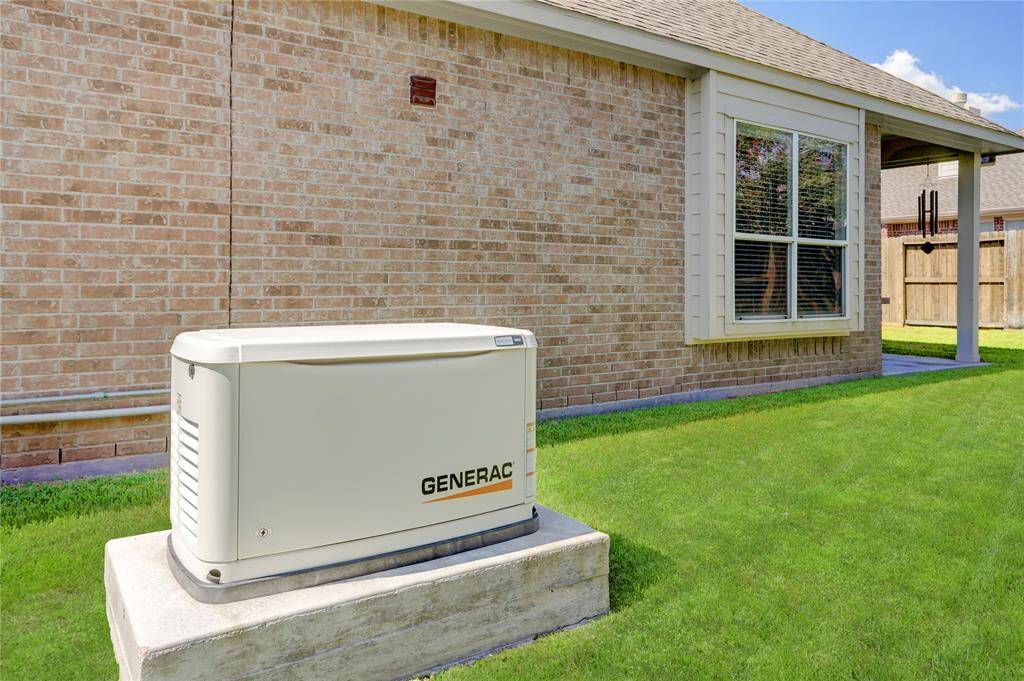 This home features boasts an 18KW Generac whole home generator, equipped for power outages and ideal for those with medical dependencies on consistent power.