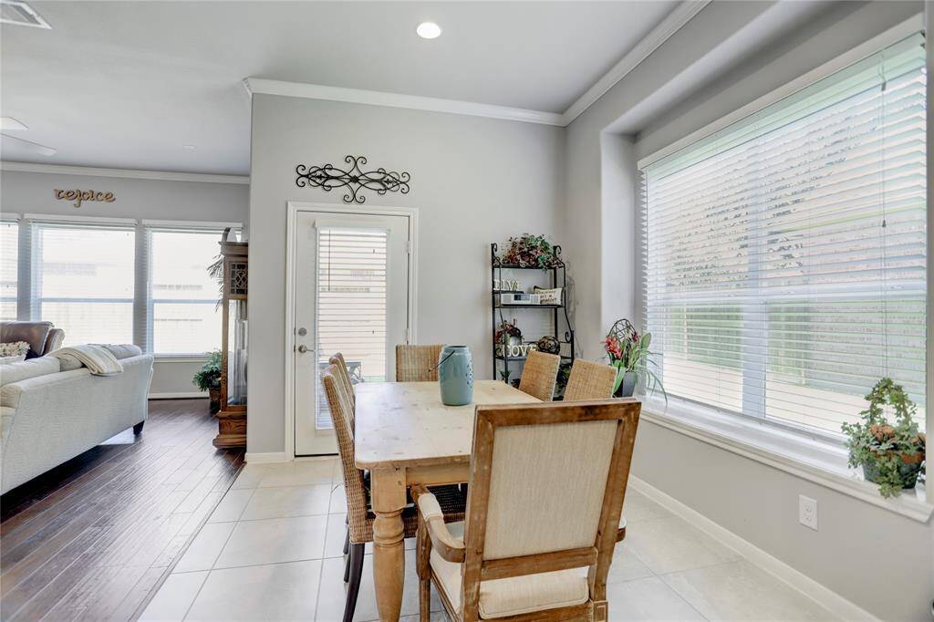 This bright breakfast room is adjacent to the kitchen and overlooks the large living room area.