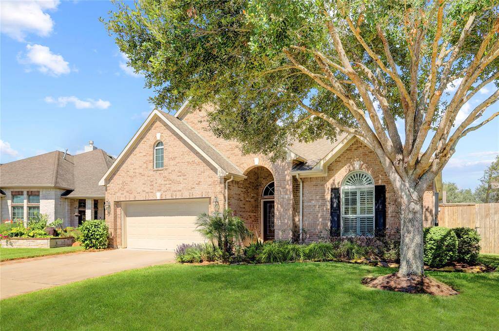 2402 W Tuschman offers brick on all four sides with cement fiber siding as small accents.