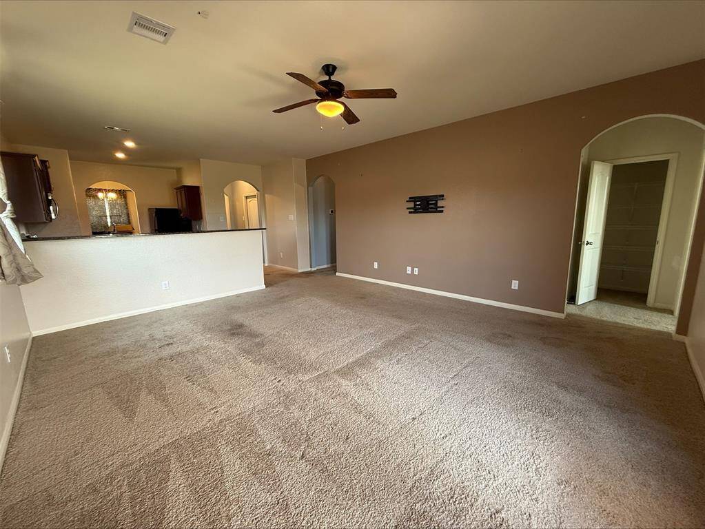 Alternate view of main living area. Primary Bedroom to the right.