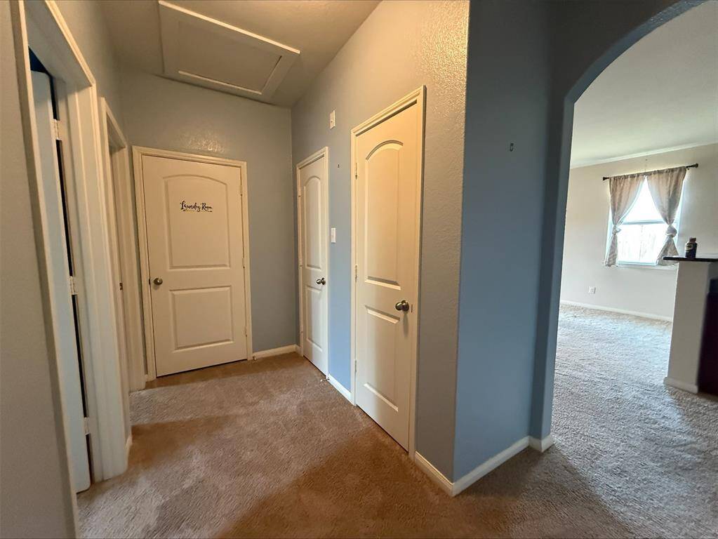 Split floorplan. Hallway to secondary bedrooms. Laundry and extra storage closets.