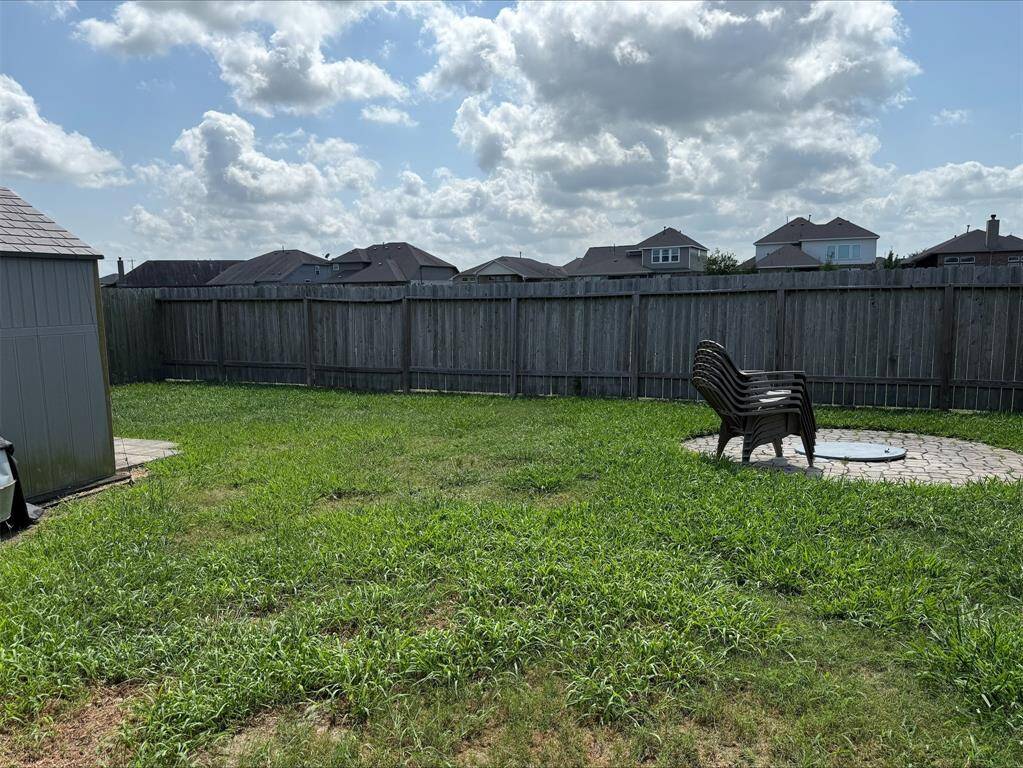 Large, fully fenced backyard.