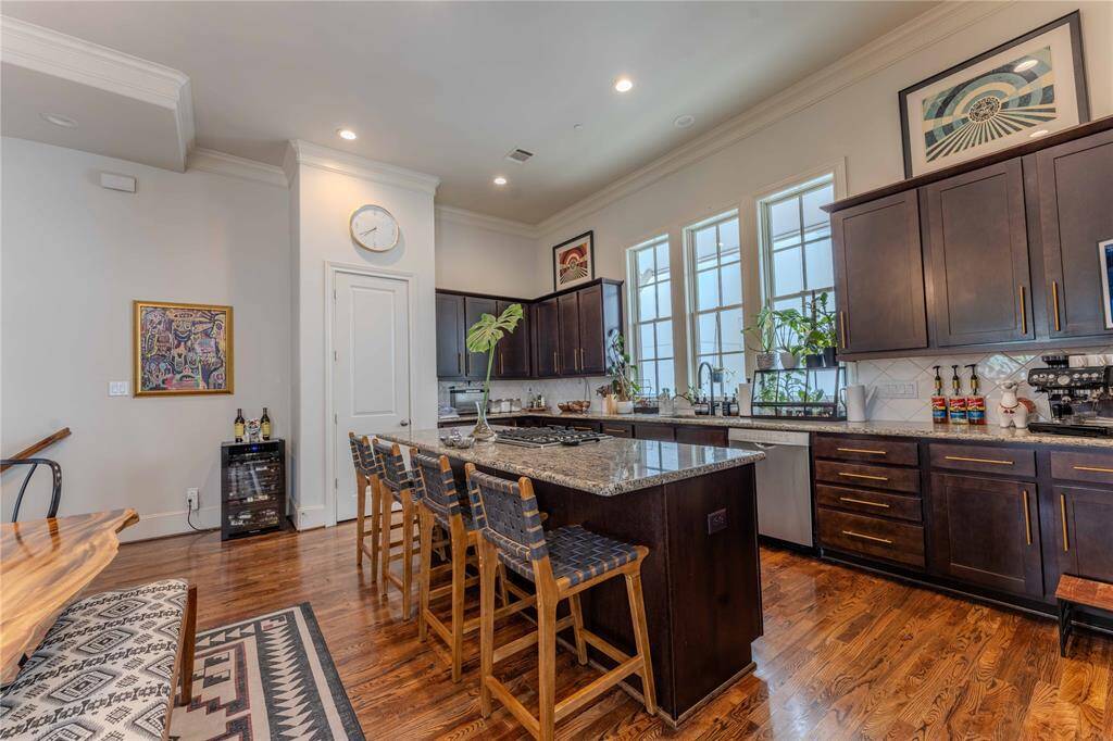 Entertain with the best! Plenty of counter space, cabinet space, island space and a pantry too.  And a gas cook top in island so you never have to miss the action while cooking.