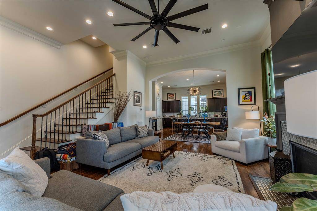 Take it all in!  Perfect sight-lines of living/dining/kitchen in this giant space with accent arches, bull-nosed corners, and gas fireplace offering even more sophistication to this amazing home.