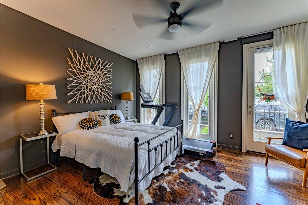The guest suite through the double doors is the perfect retreat with luxurious hardwood flooring, custom paint color, natural lighting, and access to the turfed side yard.  Or convert to an office for an exceptional WFH experience.