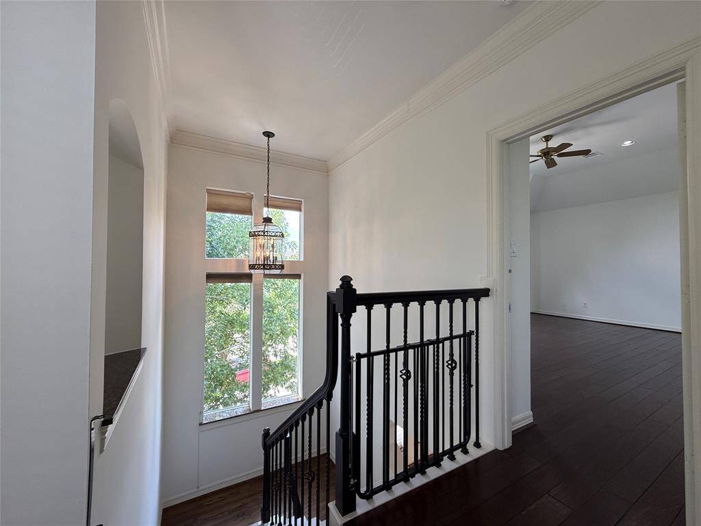 On the 3rd floor, immediately at the top of the stairs, is the primary suite.