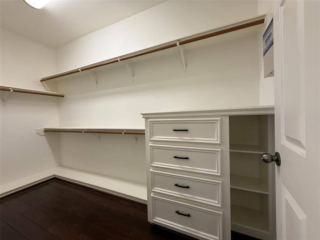The 1st walk-in closet with built-in drawers & shelving.