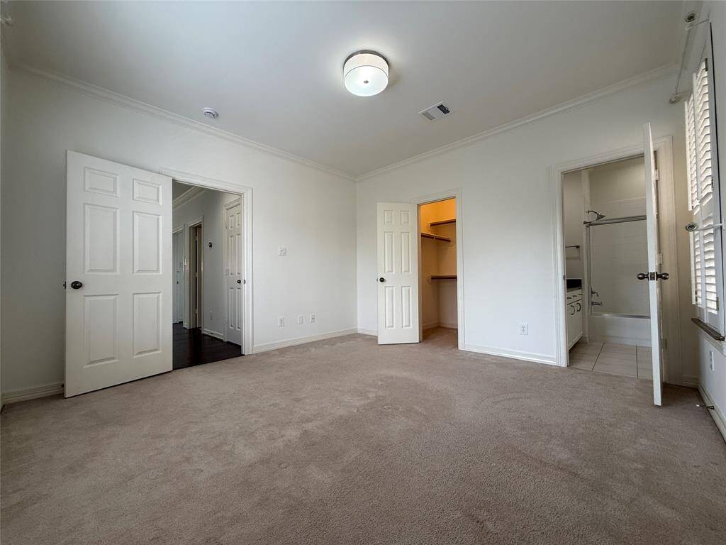 The 3rd floor bedroom offers an en-suite bath & walk-in closet.