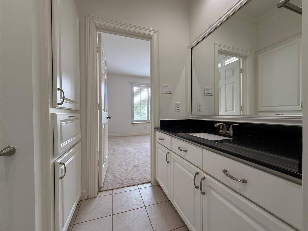 Nicely sized vanity & linen storage with built-in hamper.