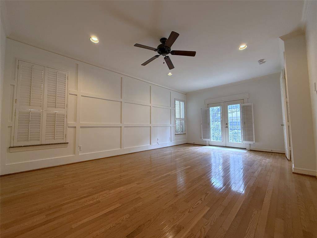 From the turfed yard, French doors open into the 1st floor bedroom.