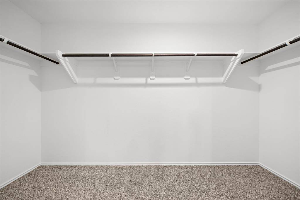 Primary walk-in closet.