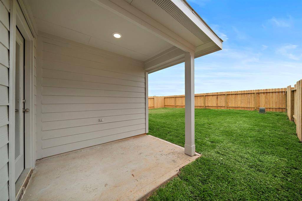 This quant covered patio is perfect for morning coffee or evening glass of wine.