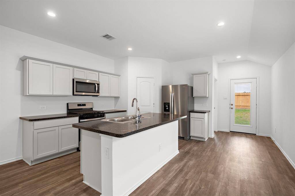 Kitchen island with space for 3 or more stools.