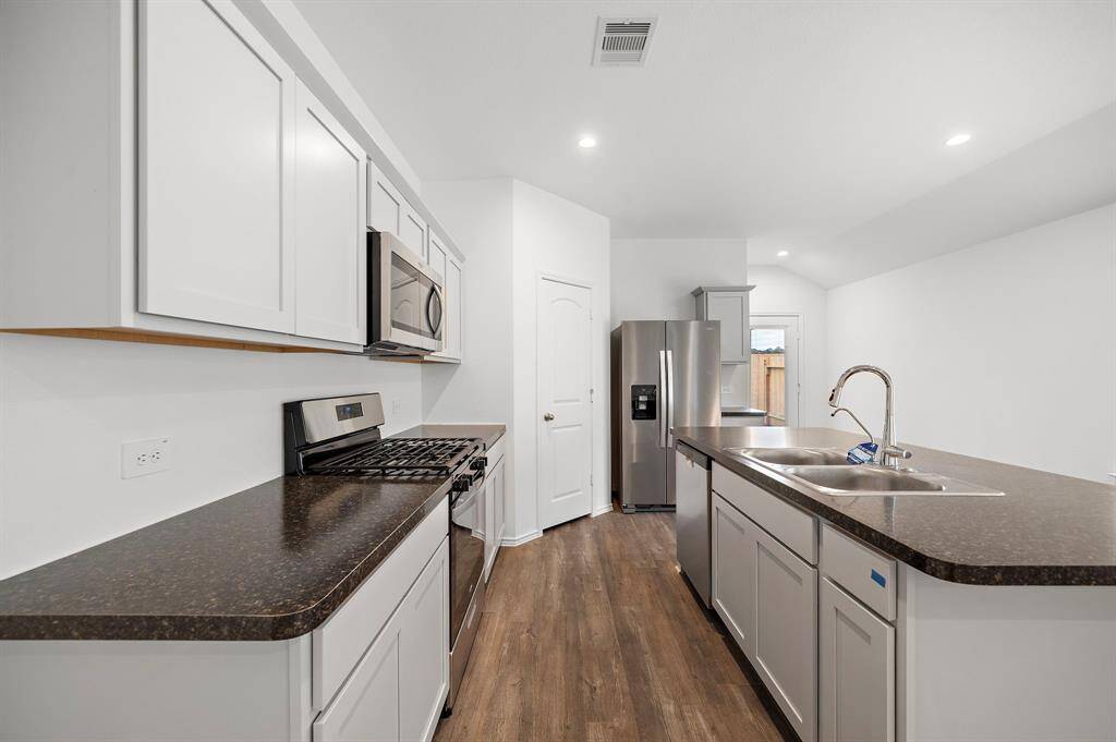 SS appliances and plenty of counter space for dinner prep.