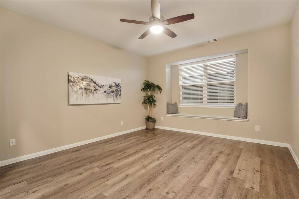 You’ll have sweet dreams in this spacious retreat featuring luxury vinyl plank flooring, soft neutral tones, and a ceiling fan for year-round comfort. The charming window seat adds a cozy touch, while the walk-in closet and ensuite bath offer everyday convenience and privacy.