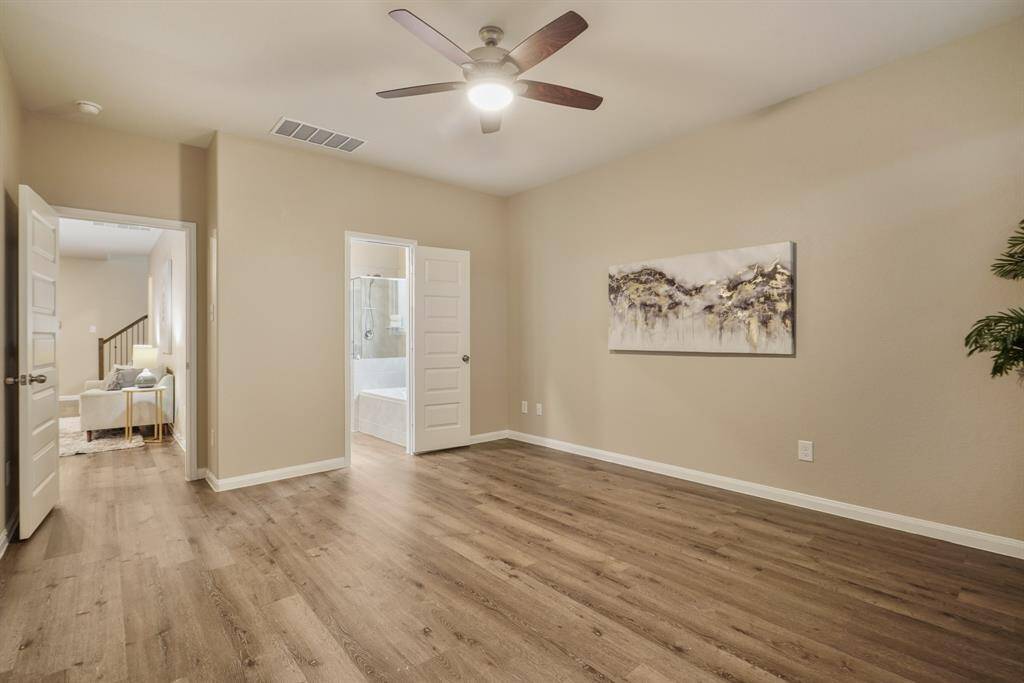 With its neutral tones, updated luxury vinyl plank flooring, and soft natural light, the primary suite offers a peaceful escape. It's the perfect space to begin and end each day in comfort and style.