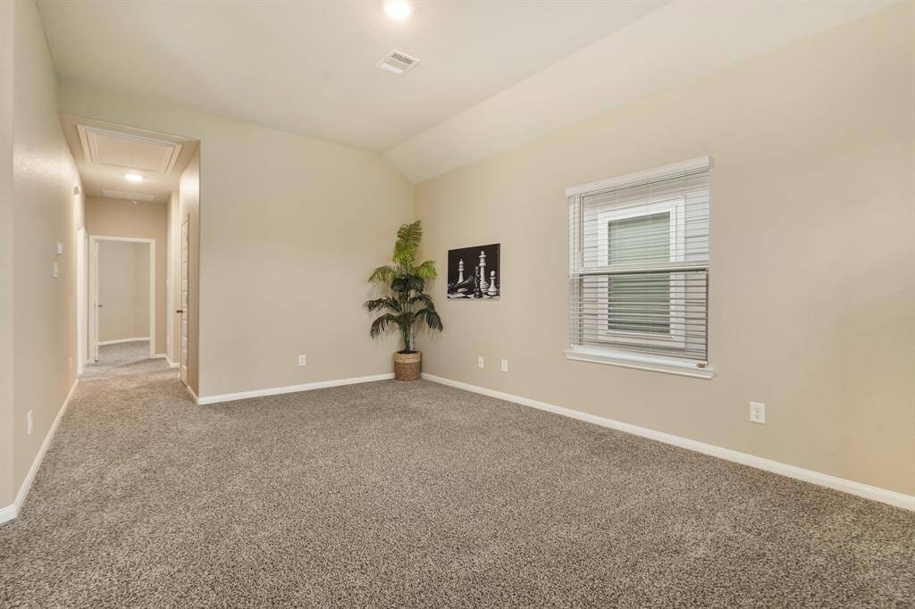 Upstairs, find this super-sized game room with soft neutral finishes, plush carpet, and plenty of room for fun and games.