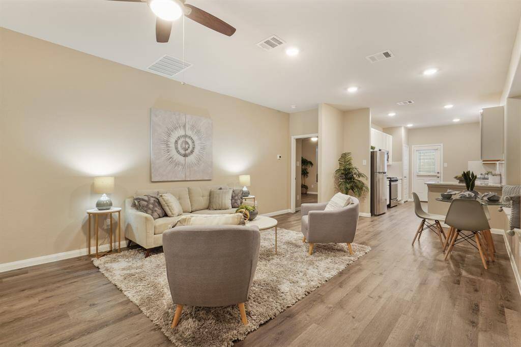Gather with friends and family or unwind at the end of the day in this light-filled open family room. The open sight lines to the kitchen and dining area make it easy to entertain or keep an eye on what's cooking while you relax.