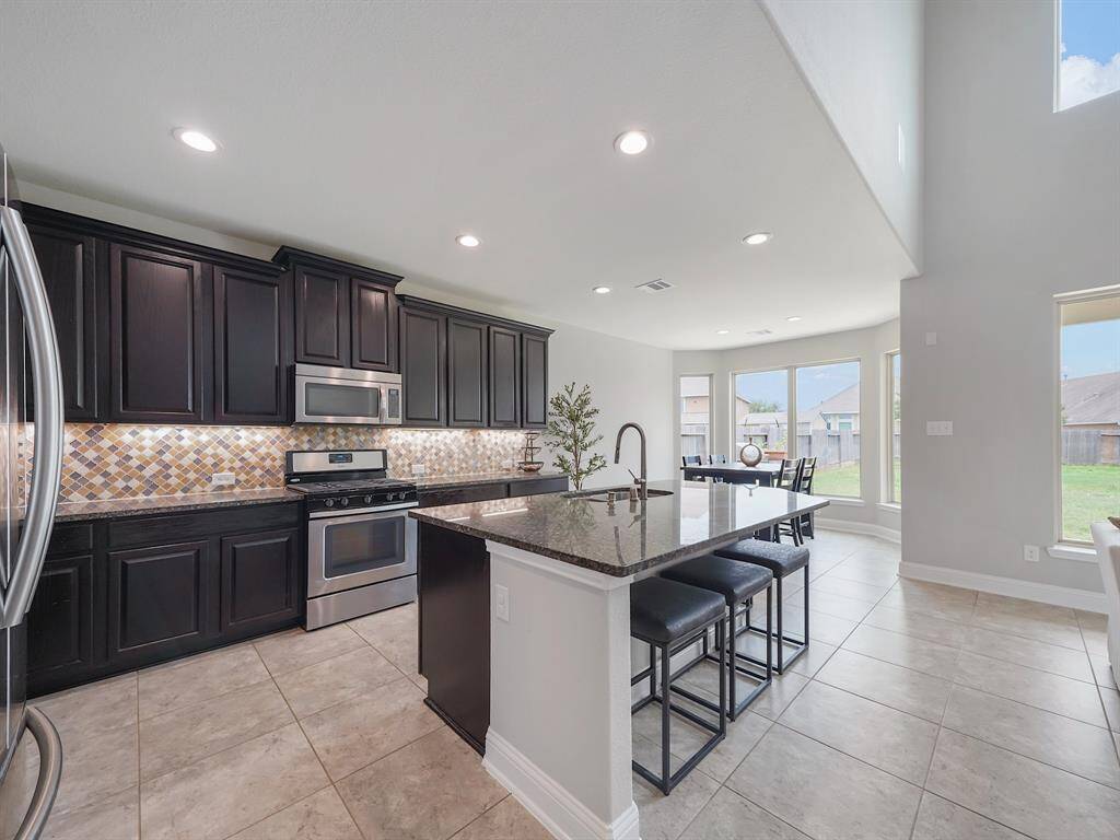 Island offers space for additional seating.