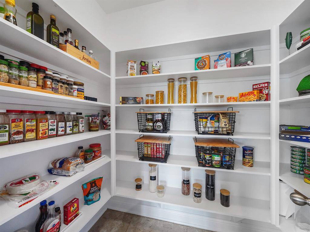 This home boasts a huge walk-in pantry, offering unparalleled storage for all your culinary essentials.