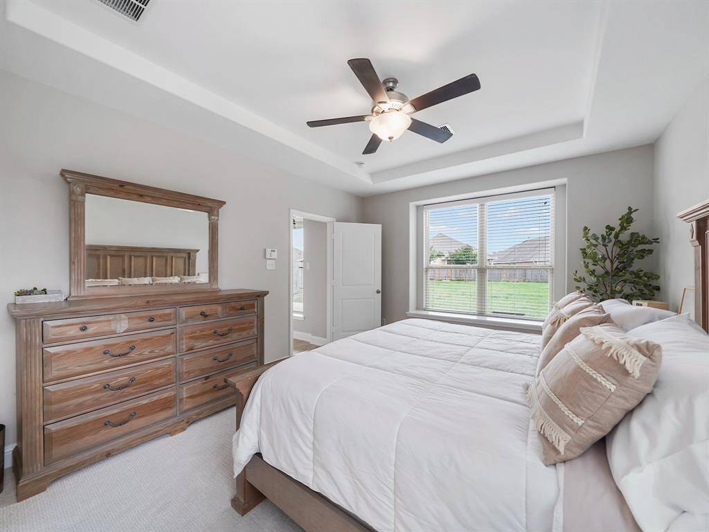 Retreat to the luxurious primary suite, offering a spa-like ensuite bathroom for ultimate relaxation.